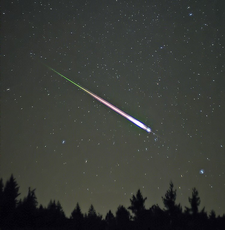 A meteor races across the sky